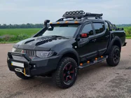 Mitsubishi L200 2006-2015 Türleisten (4 Stk, ABS) Foto 1